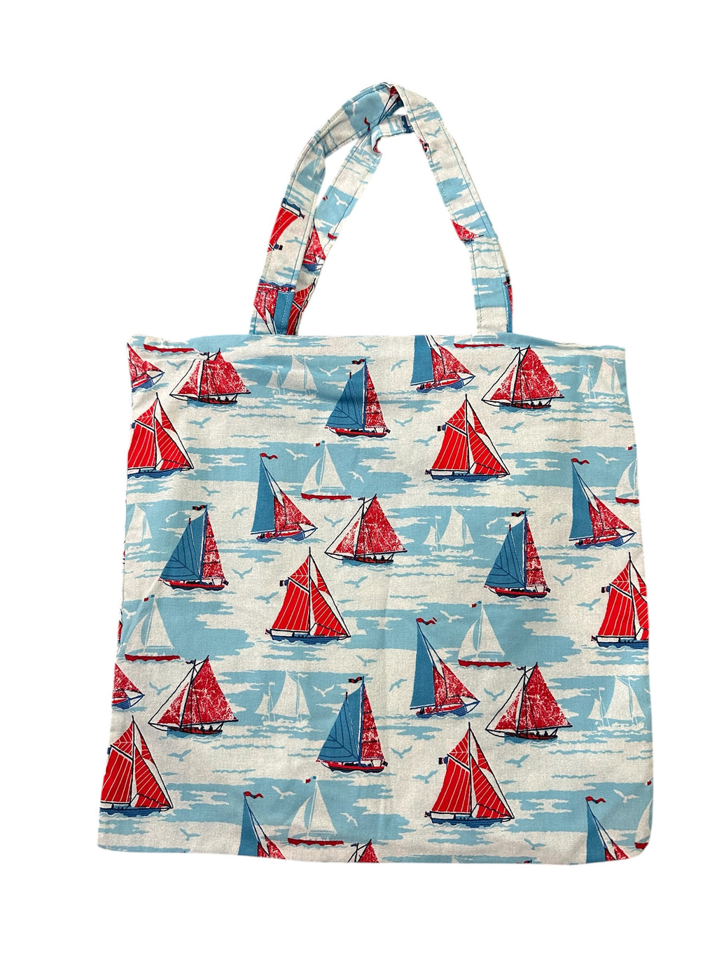 Tote bag with red and blue sailboat pattern on a white background