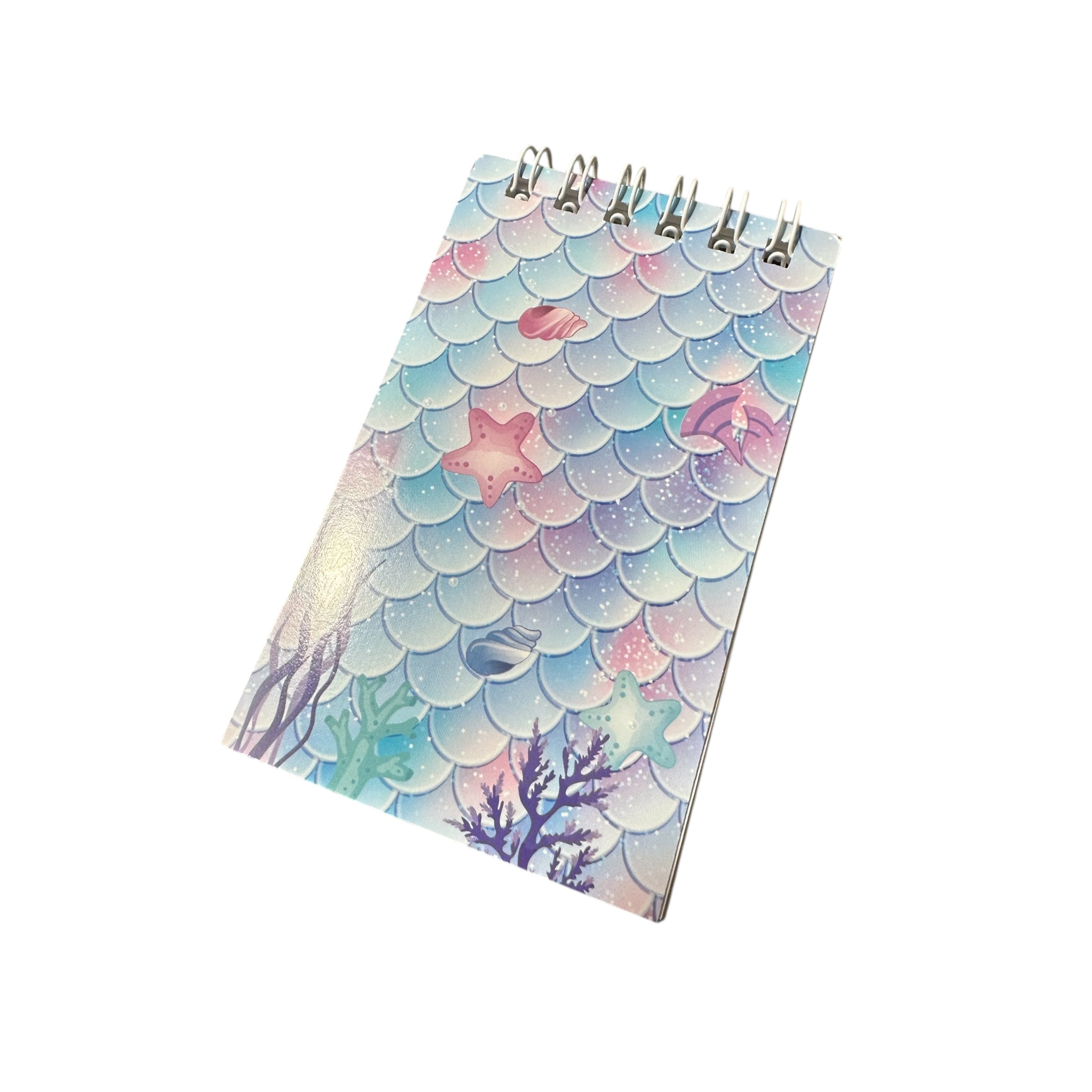 Notebook with mermaid scale design on a white background