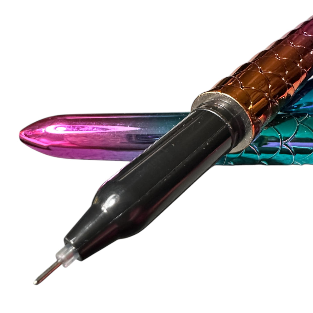 Close-up of a tattoo machine with colorful handle on a white background