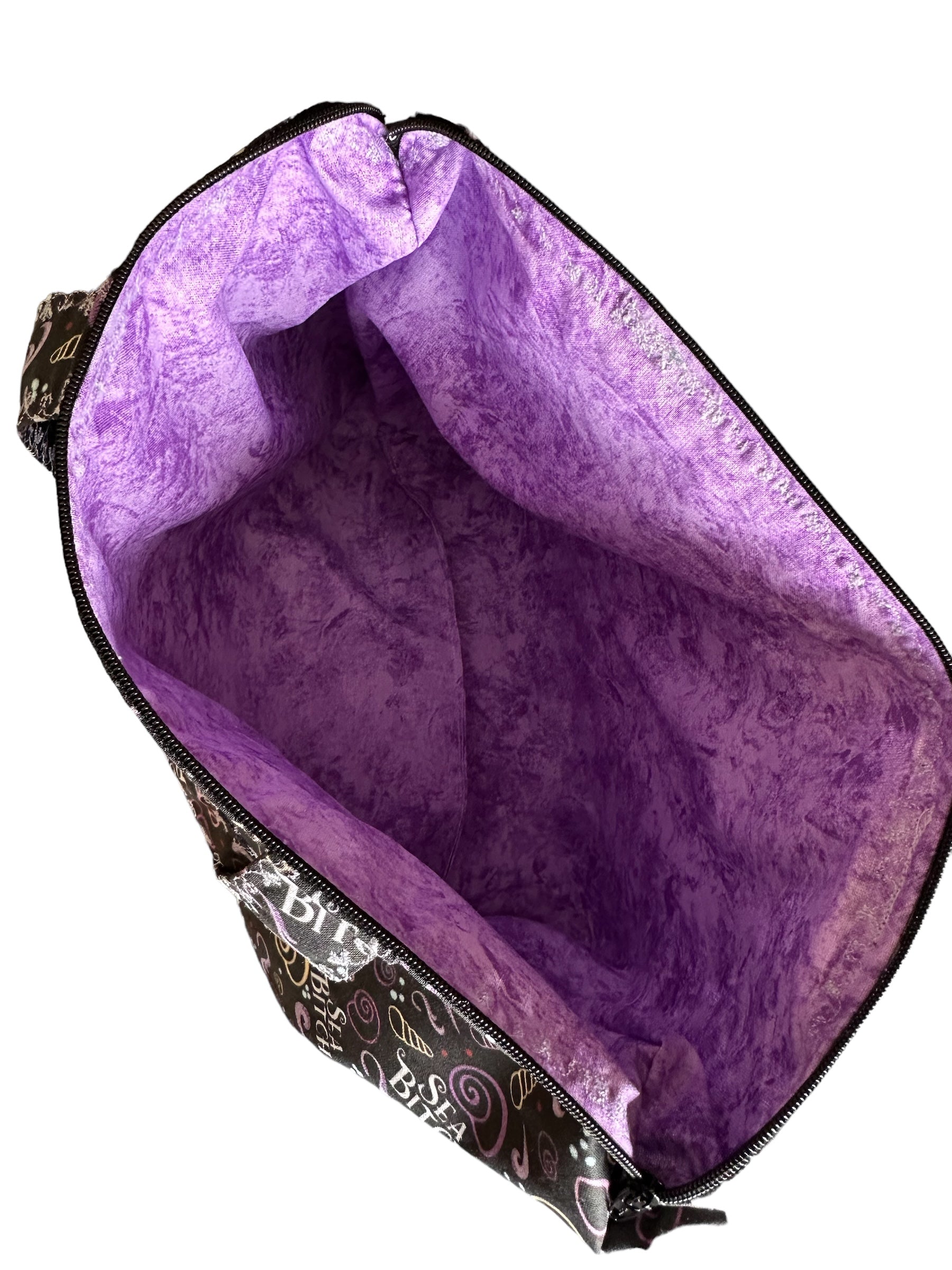 Purple bag with a black patterned base on a white background