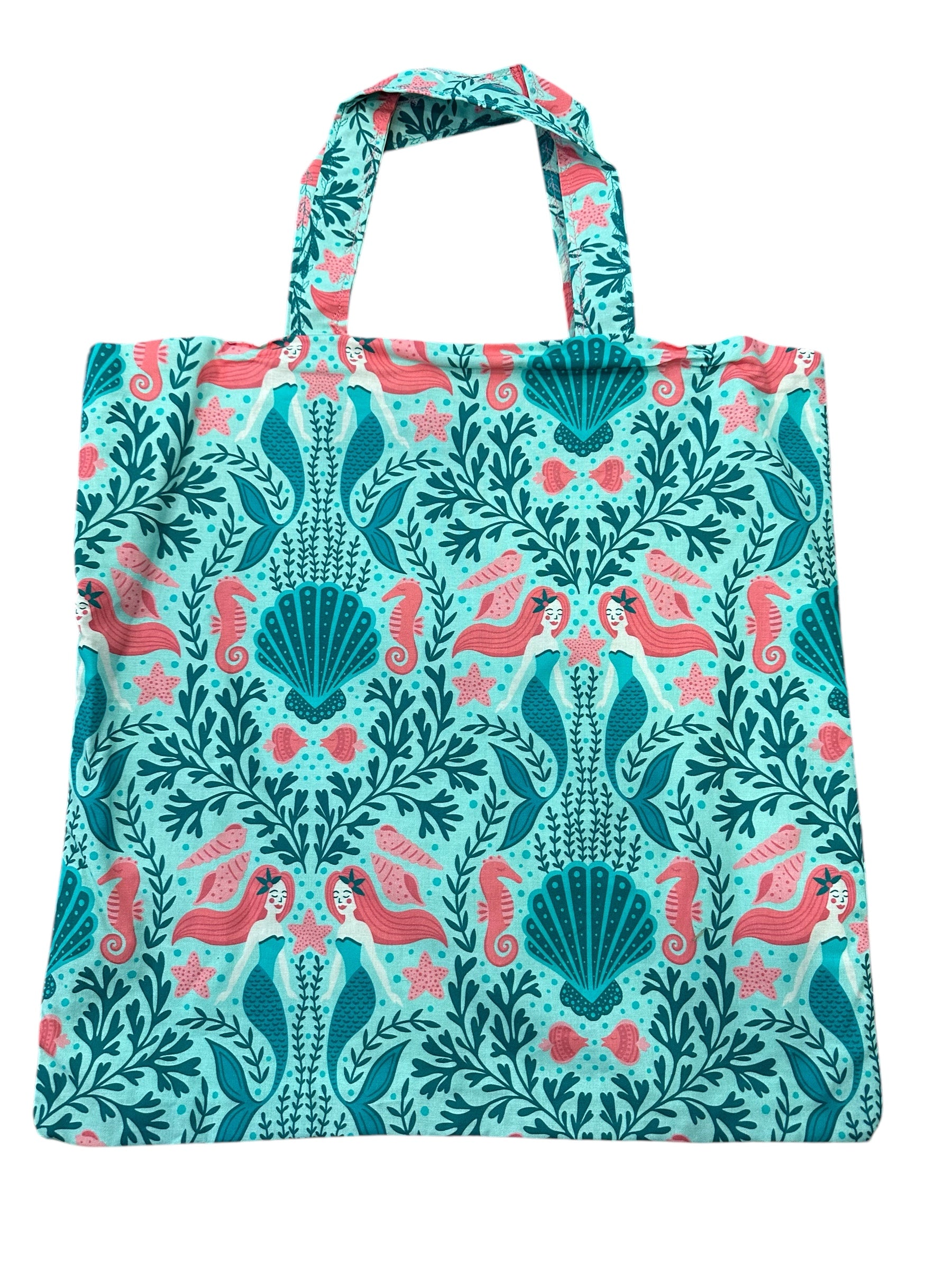 Tote bag with mermaid and seahorse pattern on a white background