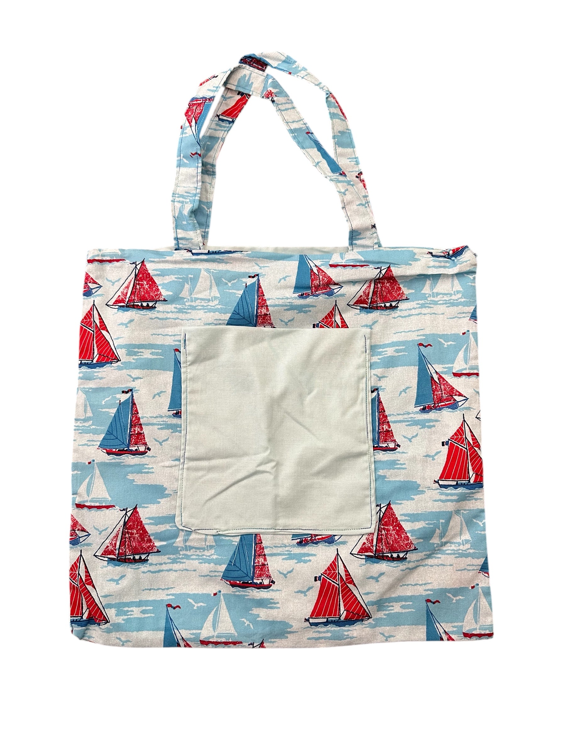 Tote bag with sailboat pattern on a white background