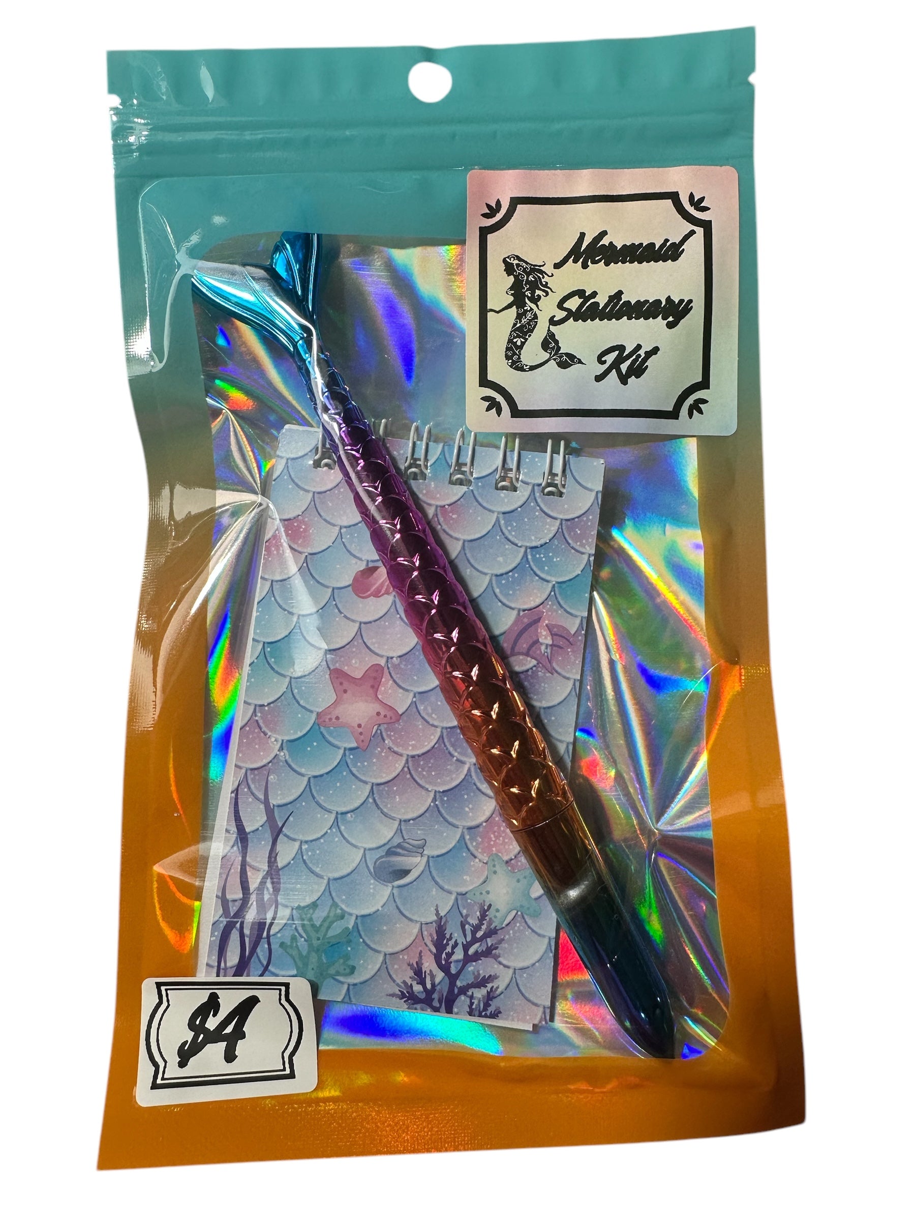 Mermaid-themed stationery kit with pen and notebook in a clear packaging sleeve.