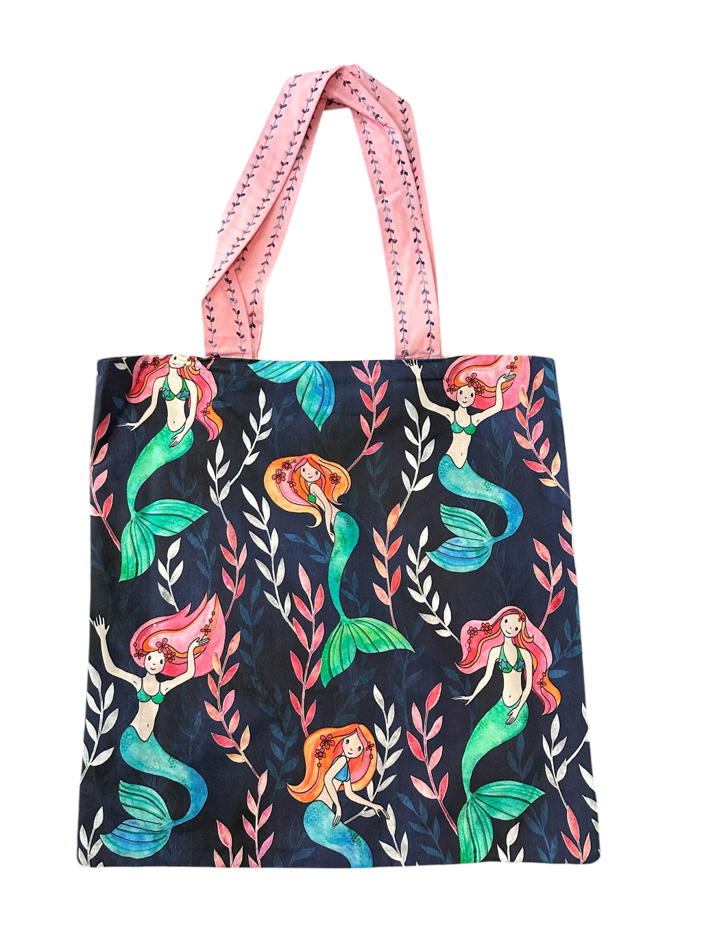 Tote bag with mermaid pattern and pink handle on a white background