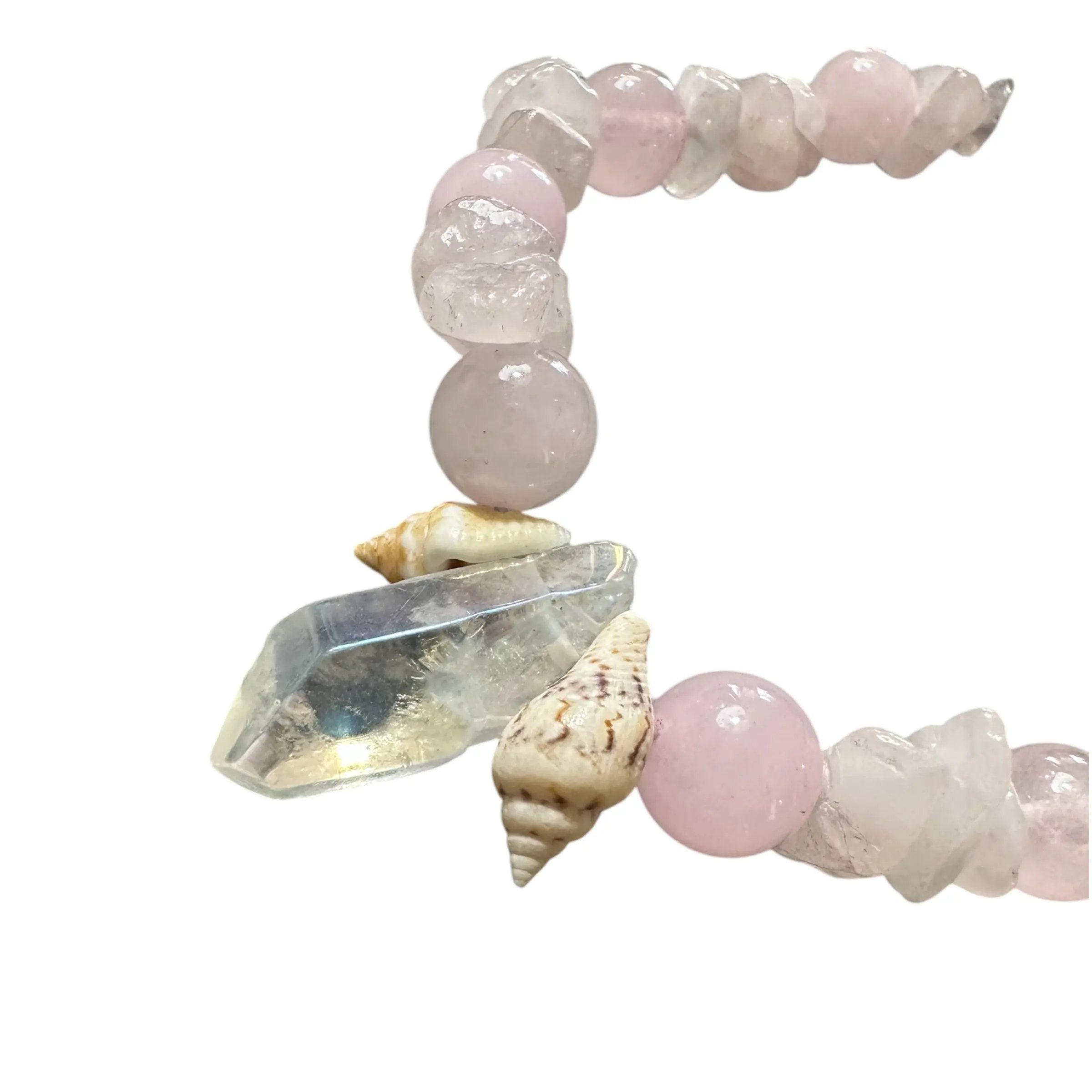 Necklace with pink and white beads, crystal, and seashells on a white background