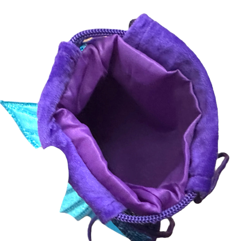 Purple mermaid tail drawstring bag with turquoise interior lining on a white background