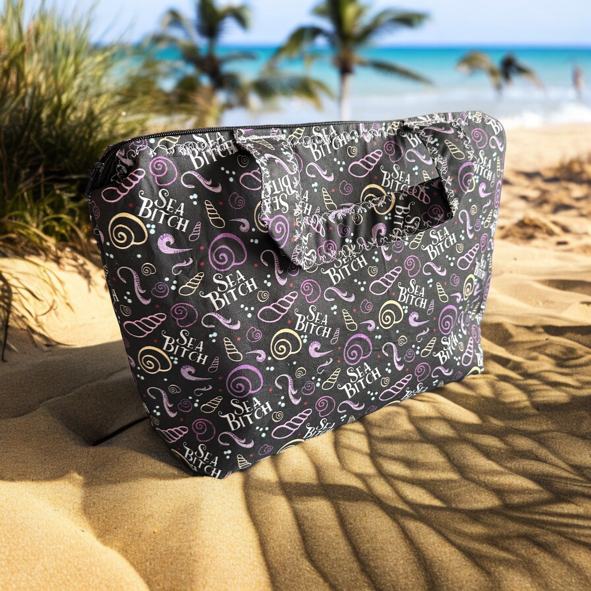 Large cosmetic ba with sea bitch design on a beach