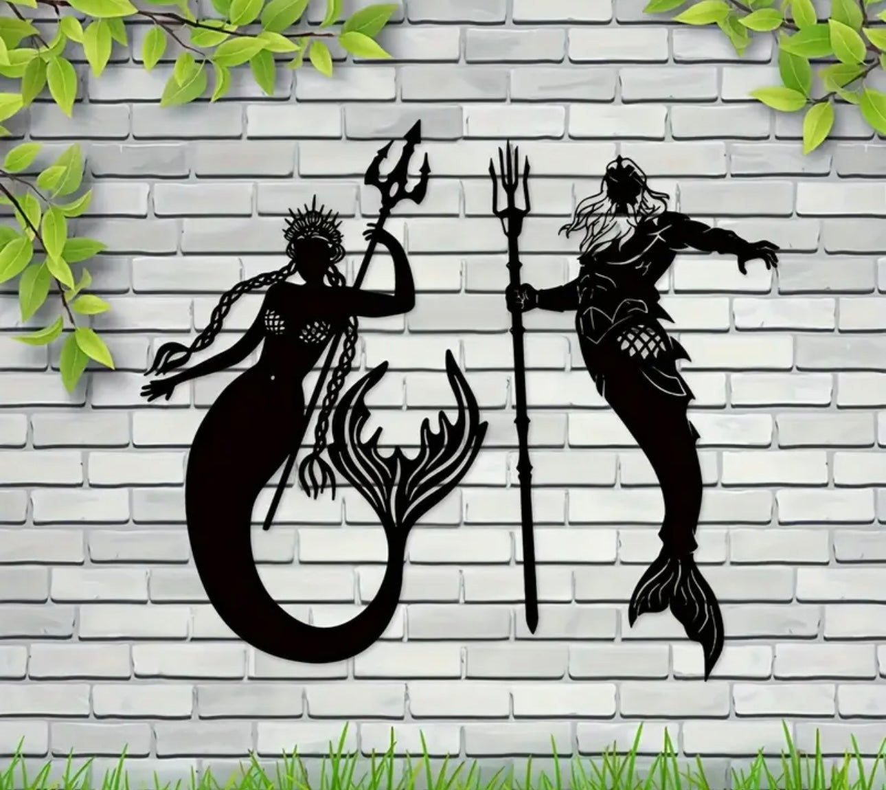 Black mermaid silhouettes with tridents on a white brick wall background