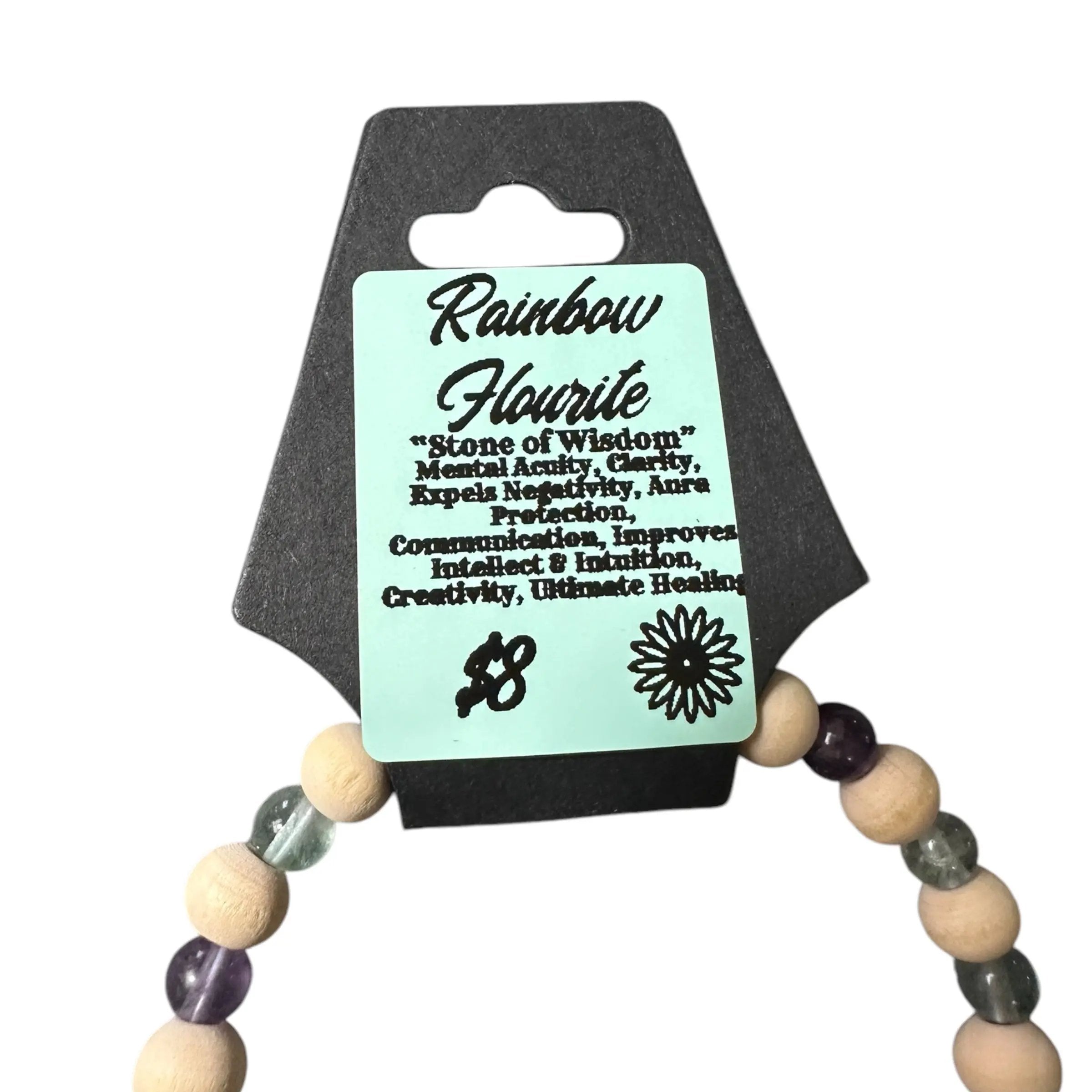 Necklace with wooden and crystal beads on a black card with text