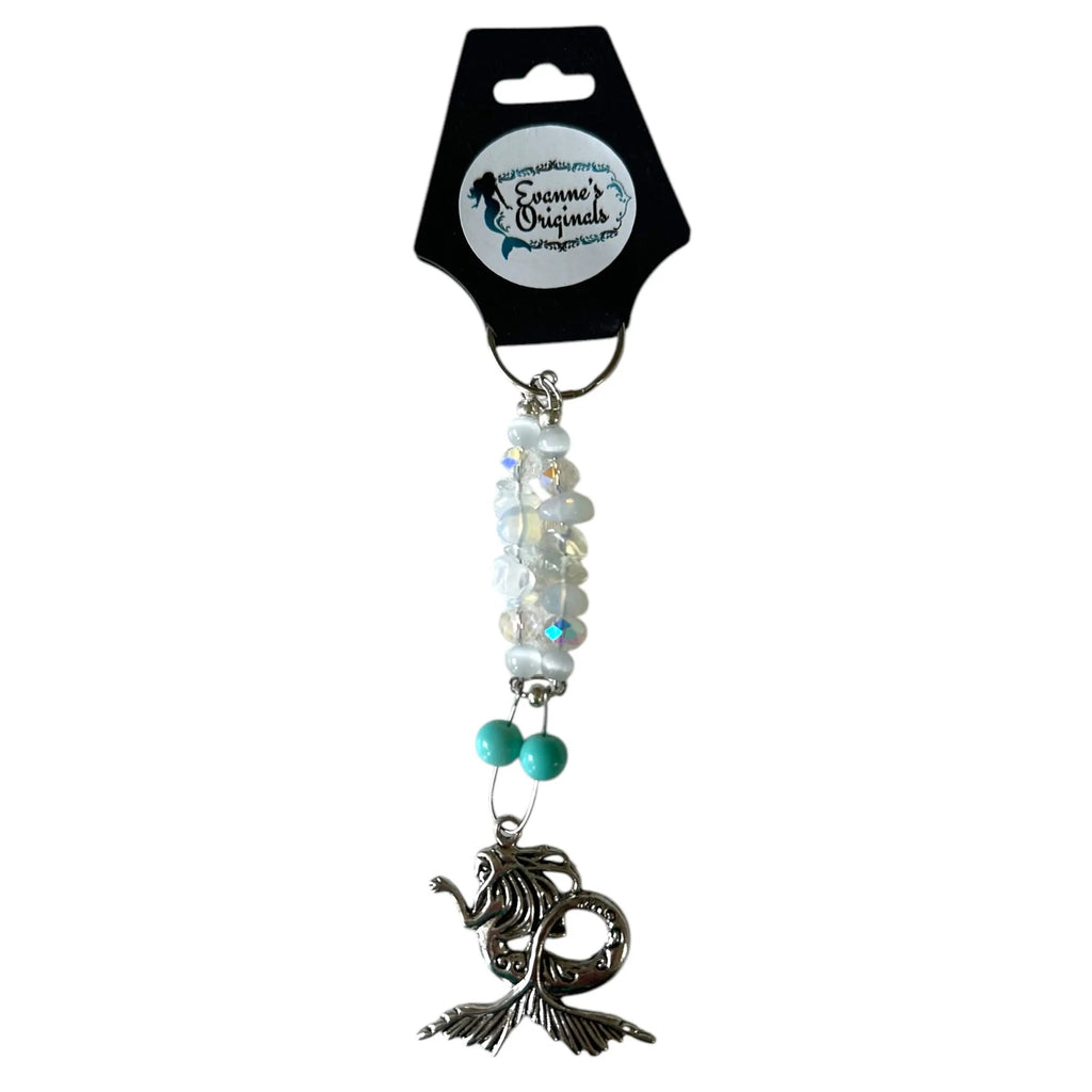 Decorative keychain with beads and a mermaid charm on a white background