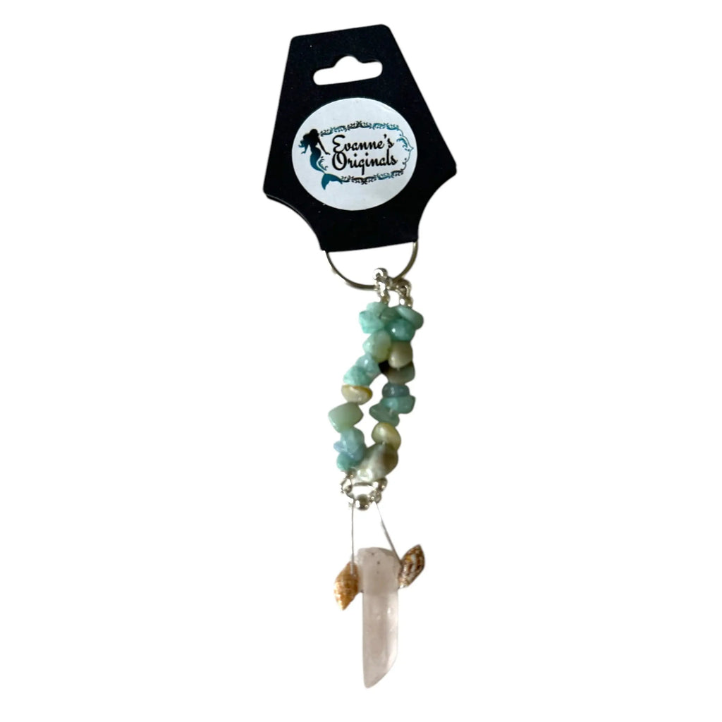 Decorative keychain with beads and a crystal on a white background