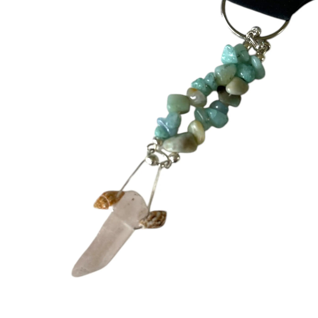 Jewelry with turquoise stones and a stone pendant on a white background