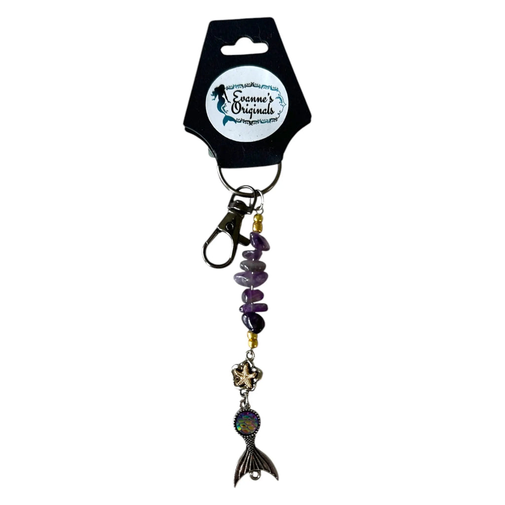 Keychain with mermaid tail design on a white background
