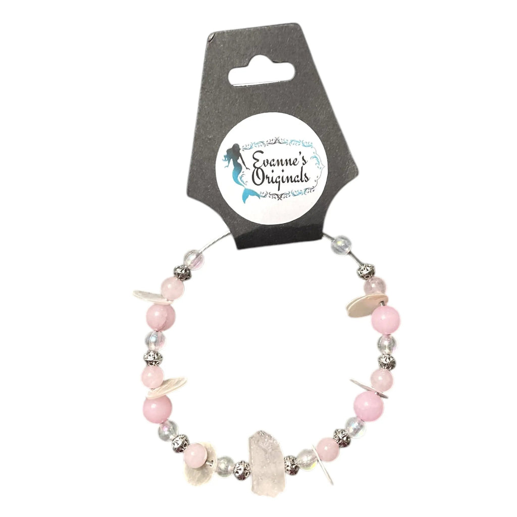 Beaded bracelet with pink and silver beads on a branded card