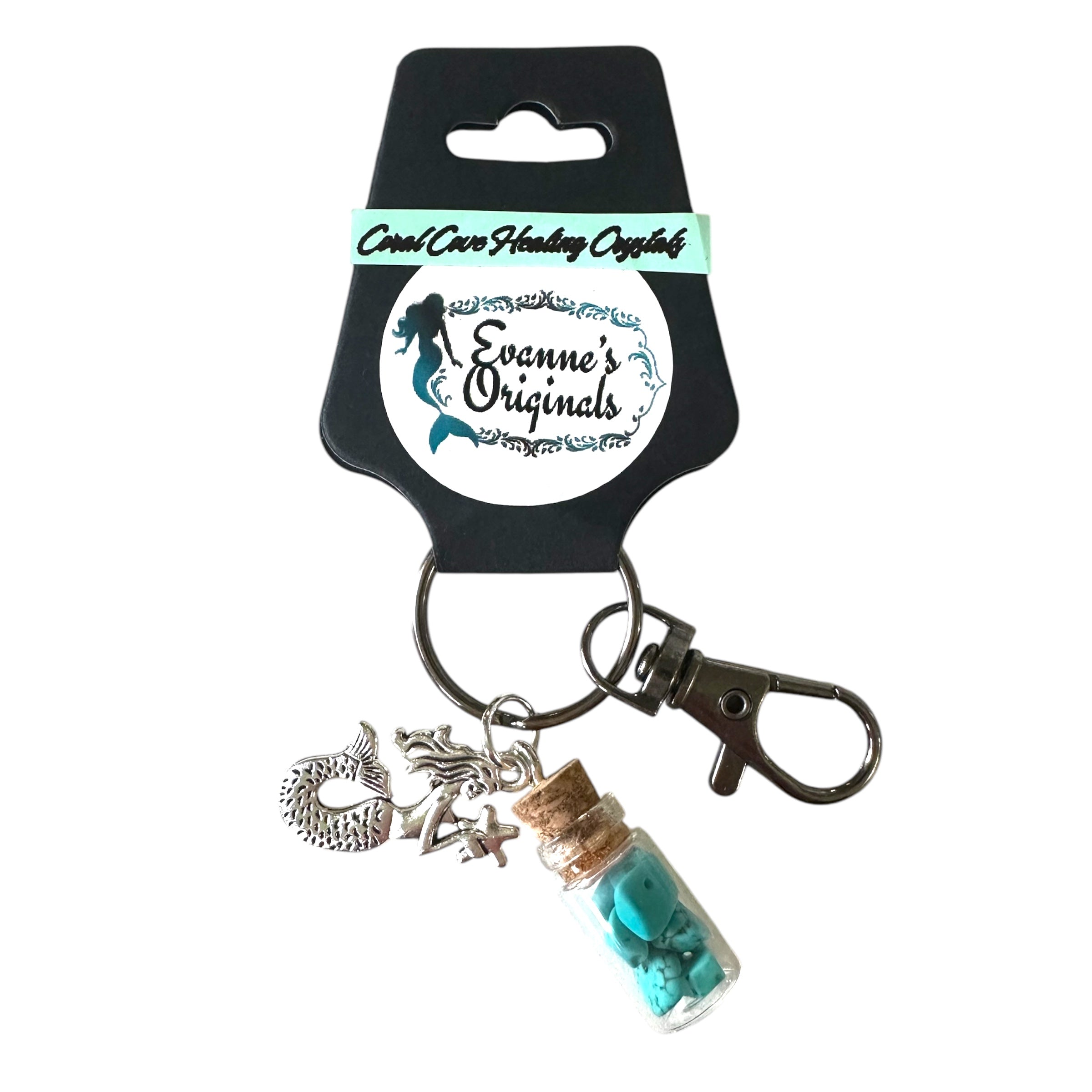 Keychain with mermaid charm and bottle pendant on a branded card